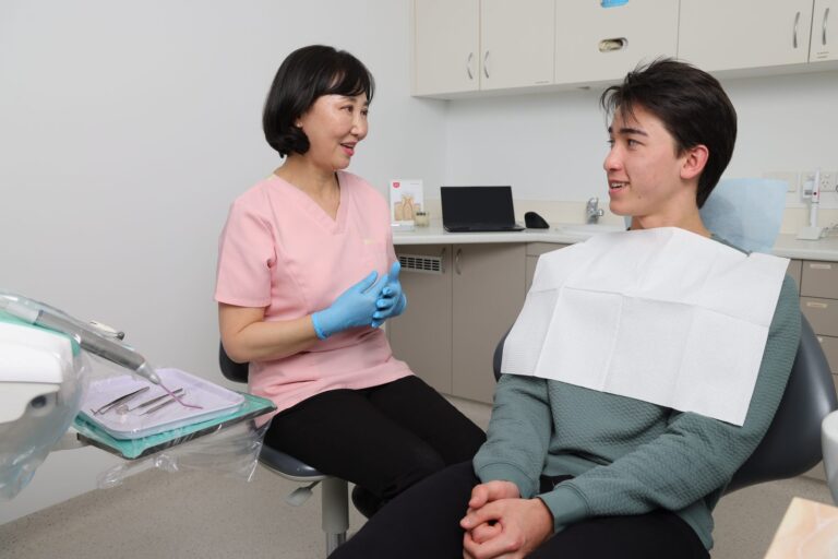 Dentist talking calmly with a patient before treatment