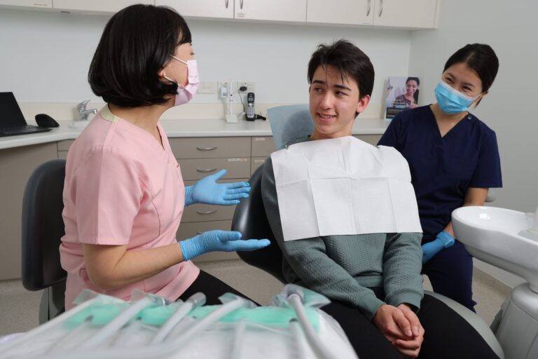 Dentist and assistant with a patient