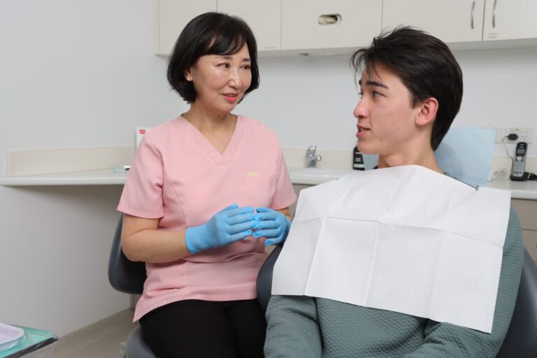 Dentist talking with a patient before treatment