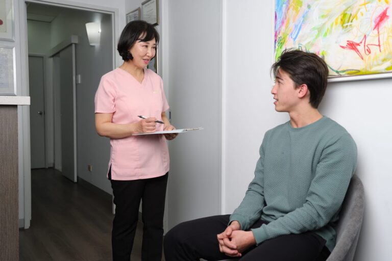 Dentist discussing treatment with a patient
